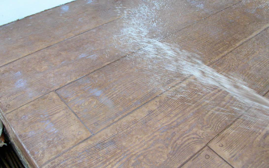 The sealer puddled in low areas and was overapplied as result. The sealer turned white every time it got wet.
