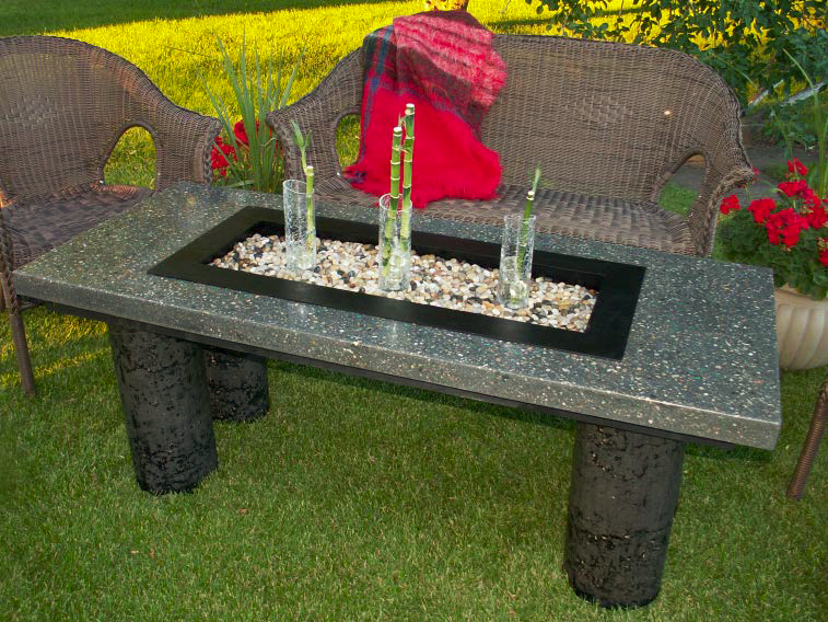 A sturdy concrete table with a center area for decoration.