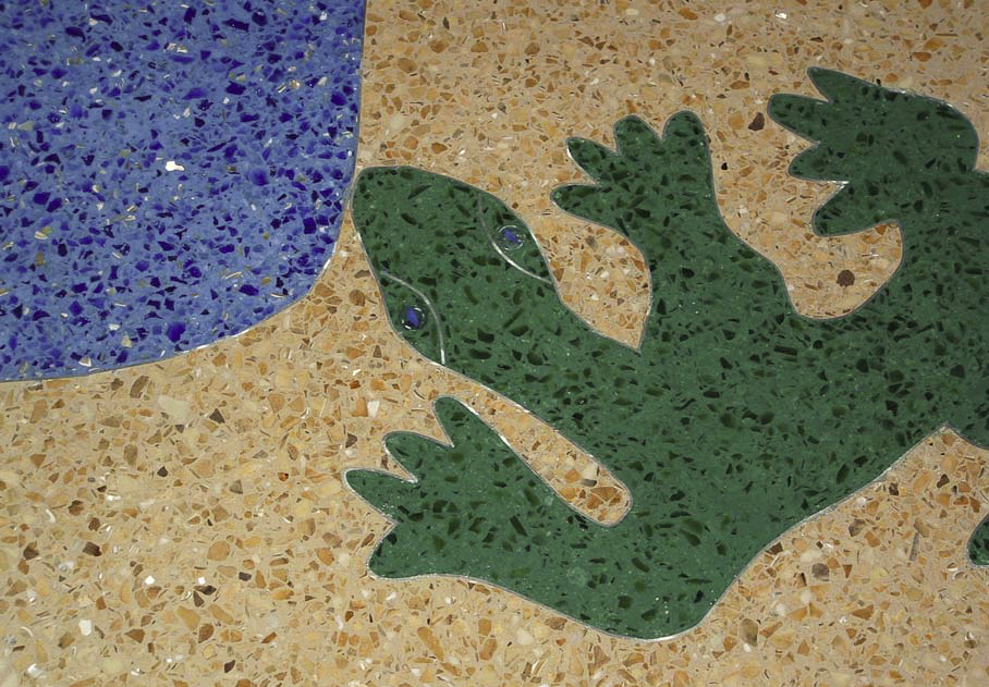 Large gecko inlayed into the floor using the terrazzo technique.