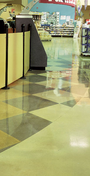 Stained concrete floor in a geometric pattern in a grocery store.