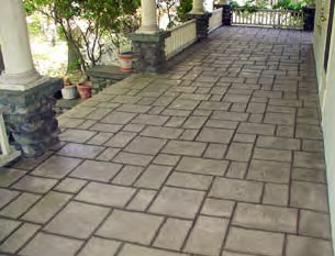 A resurfaced concrete deck with stamped concrete and stain.