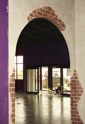 Arched doorway with "faux" exposed brick.