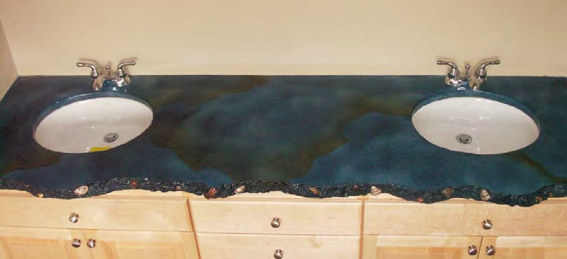 This concrete countertop in the master bathroom features exposed shells highlighted with paint.