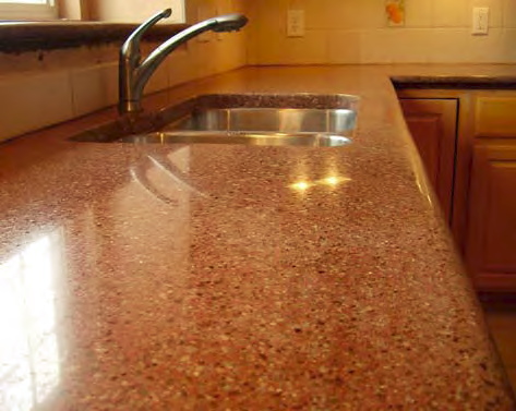 An orange concrete countertop with clean lines and a smooth finish.