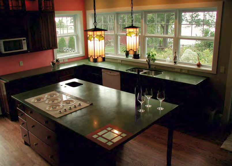 A green countertopped kitchen makes a very nice aesthetic in this natural kitchen.