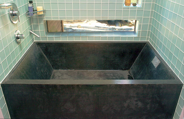Stone Soup Concrete created this black tub from five tongue and groove pieces. It weighs 1,750 pounds and has a 120-gallon capacity.