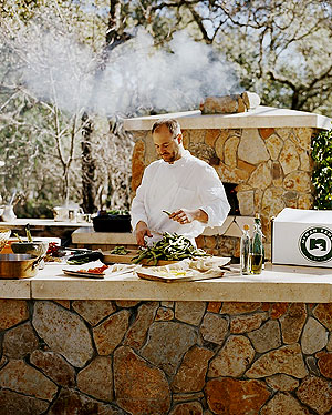 A chef prepared a dinner on a outdoor kitchen.