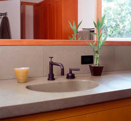 Bathroom concrete countertop precast integral sink with concrete backslash.