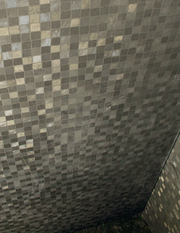 A look at a concrete shower wall that has been detailed with the casting mat from Preitech.
