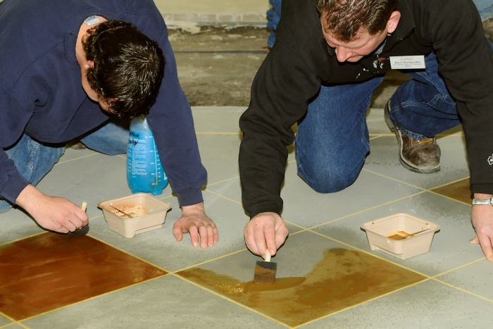 staining concrete on a floor with water-based stains