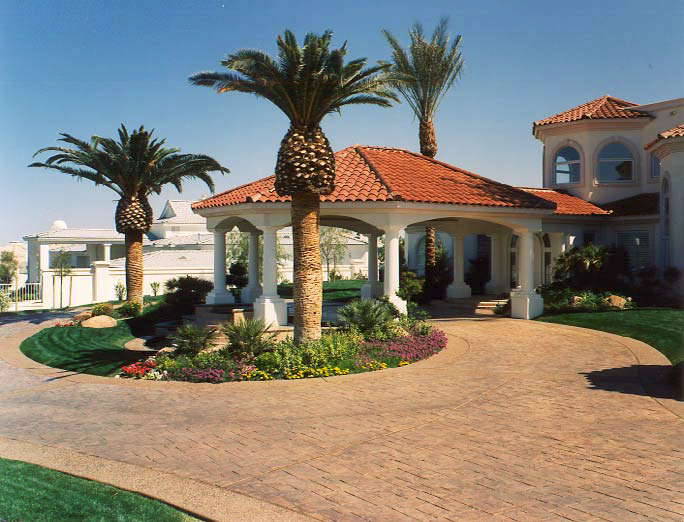 Spanish style home with a gazebo and stamped concrete bring this house into a high-end look.