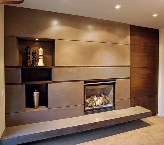 Living room/dining room fireplace and coffee table: The double fireplace was one of the most challenging projects in the entire house. The dining room side is an artistic mixture of concrete, walnut columns and glass panels.