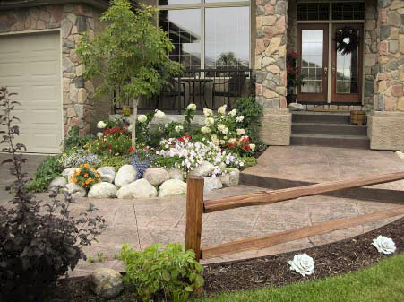 Front entrance to a home with flowers and railings create a welcome to guests.