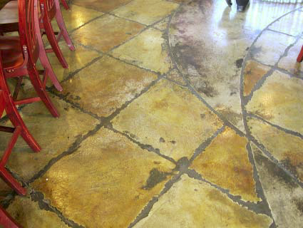 Rustic looking tiles that were created with stained and carved concrete