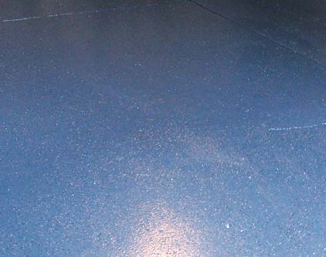 Opaque epoxy coating mimics the look of acid stained concrete. Photo courtesy of H&C Concrete Coatings