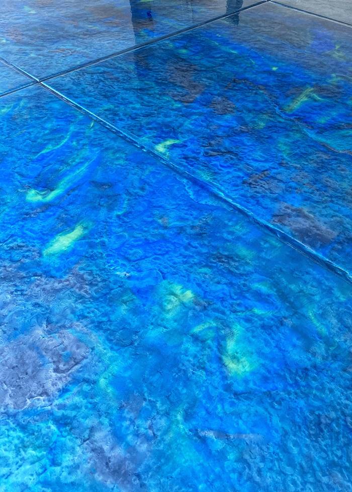 Choosing metallic epoxy colors in bright blue can give the homeowners what they want - an ocean blue floor.