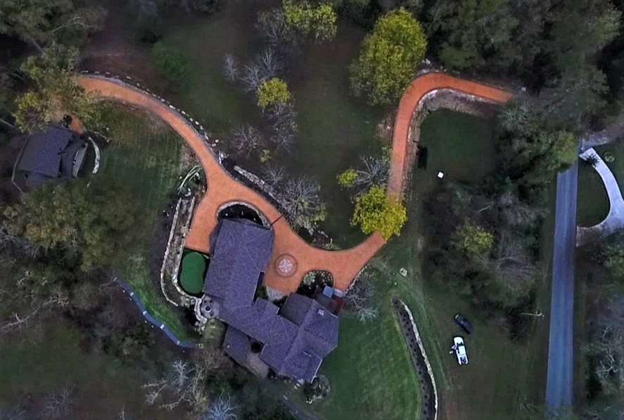 A large aerial view of a 14,000 square foot driveway that has been upgraded with the decorative side of concrete