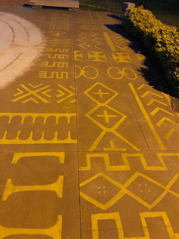 The outside of the concrete labyrinth with designs and patterns