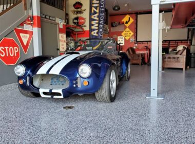A classic sports car in a garage with epoxy flake