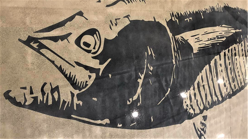 A custom tuna stencil was applied to the concrete floor.