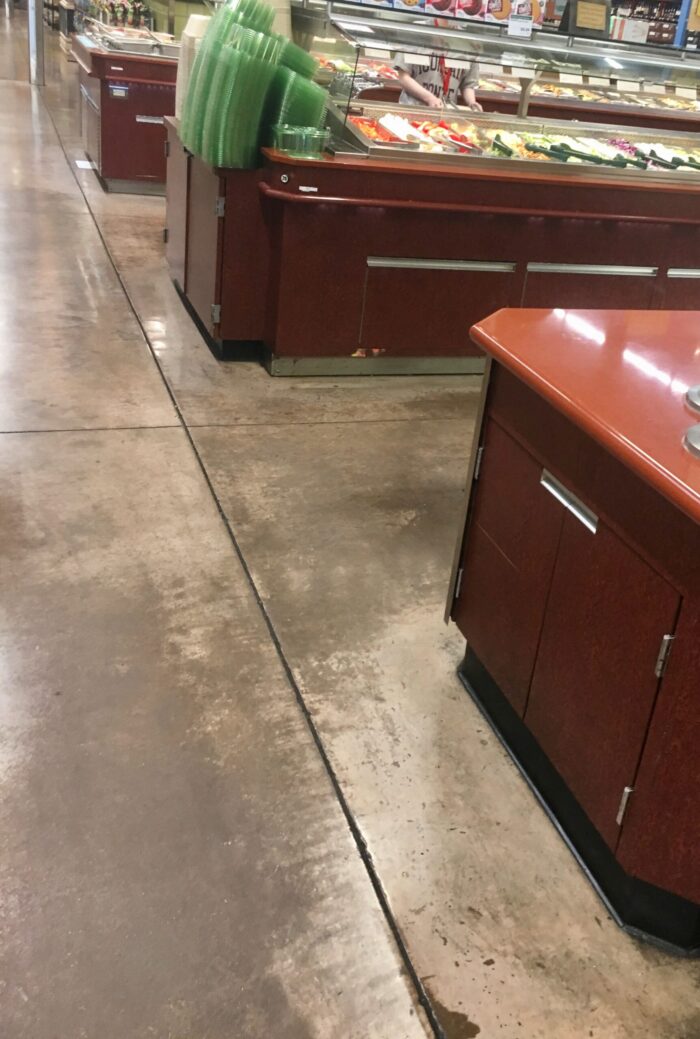 A grocery store's concrete joints can be a place where bacteria lurks. Without joint filler, they are harder to clean.