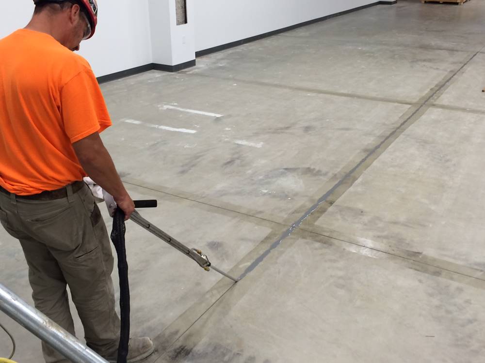 a contractor fills control joints with filler