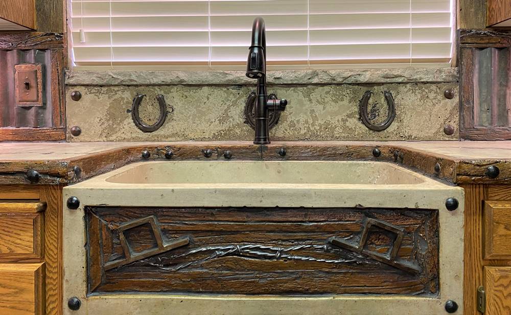 a concrete sink front finish the look of this rustic kitchen
