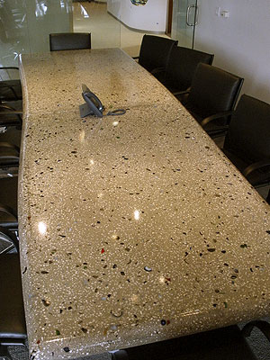 A look a the concrete conference table that was inlayed with glass and curved for a more artistic look.