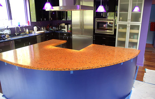 Stone Soup Concrete used bright colors or orange and purple in this concrete countertop.