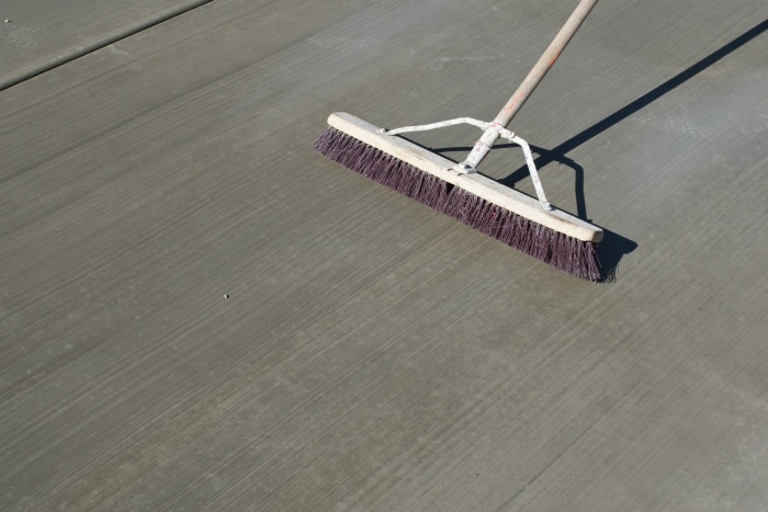 Broom finishing macrofiber-reinforced concrete