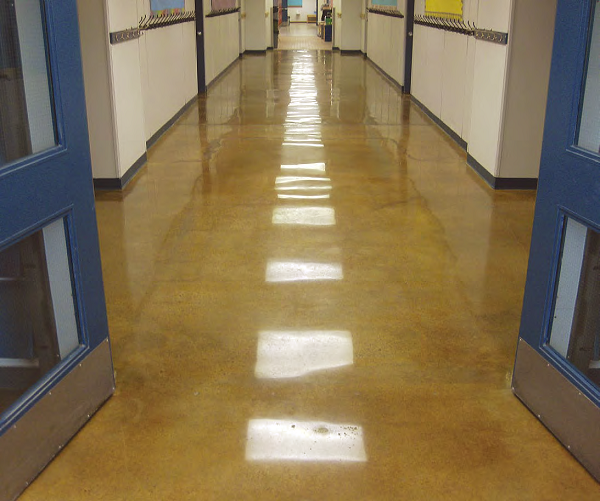 Clint Buswell, Concrete by Design, Alberta, Canada, created the floor in this hallway at St. Matthews Middle School, Rocky Mountain House, Alberta. He used Prosocos Consolideck LS lithium-silicate hardener/densifier and a caramel-color acetone stain to do it. The floor is polished to an 800-grit resin finish, and the glossy microthin lithium-silicate-containing protective coating has been burnished in at 3,000 rpm.