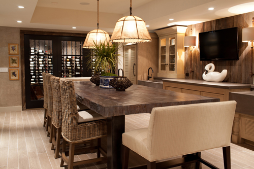 A dining room in a modern home with a wood look concrete dining room table.