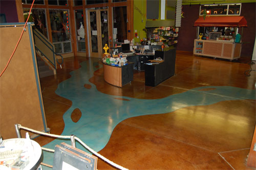 A river of blue stain was placed on this concrete floor.