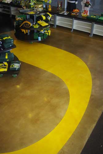 The vibrant yellow O adorns this concrete floor.