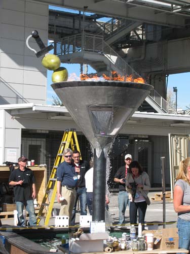 The concrete martini glass with flames and water.