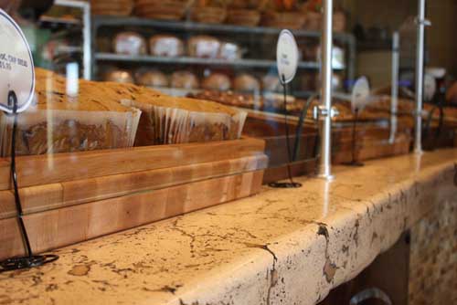 Concrete countertop at this bakery gives a rustic and homey feel.