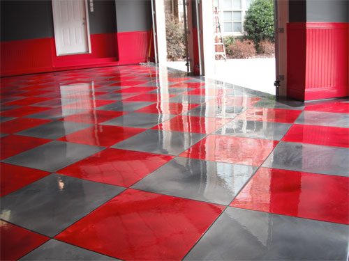 A finished epoxy floor with gray and red tiles.