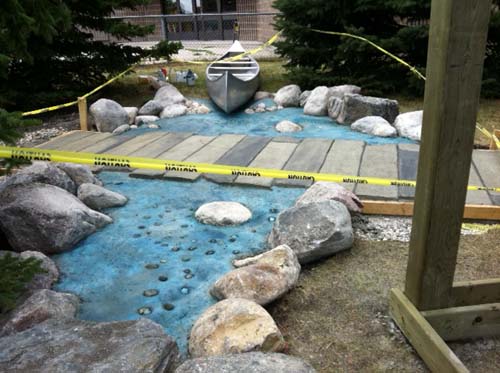 A view of the bridge over the faux water created so kids can't fall into the water or off of it.