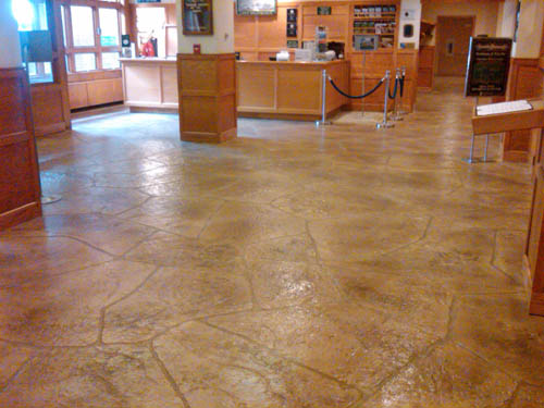 The floor was created by using a thin stampable overlay and other materials from Elite Crete Systems to put down the look of unique large stones.