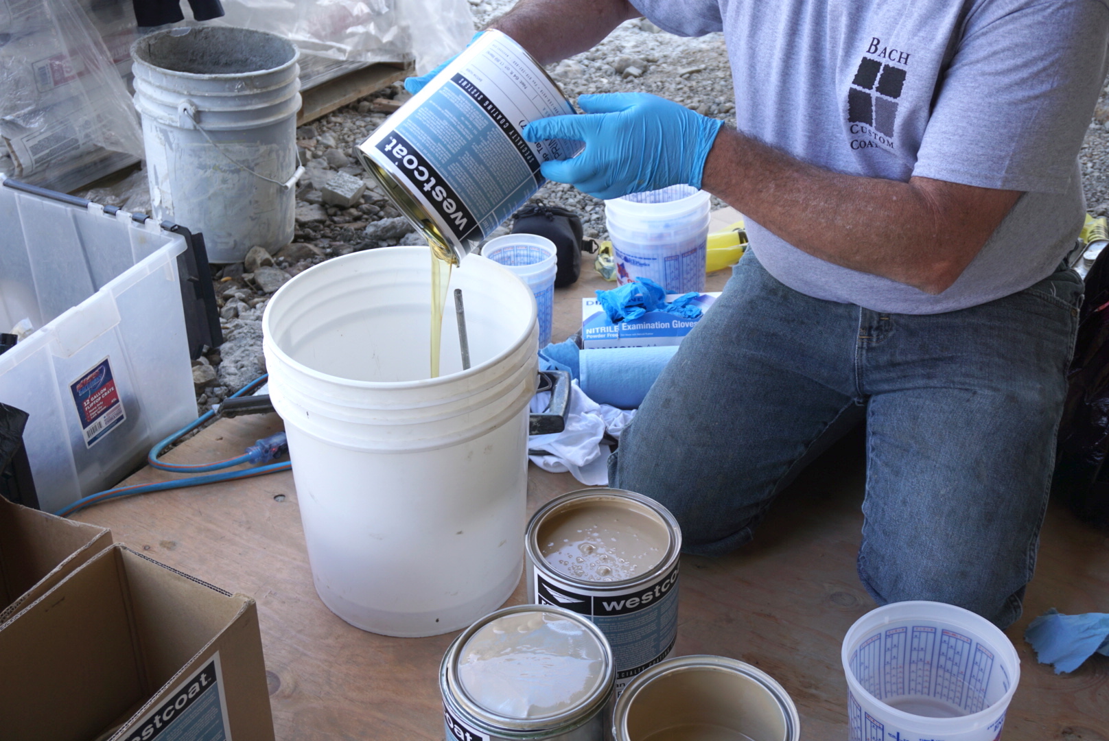 pouring westcoat product in bucket