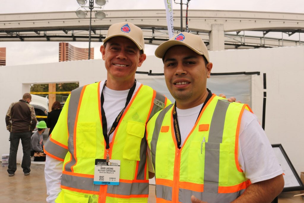 contractors at decorative concrete live wearing safety vests