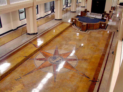 stained concrete floor with compass design
