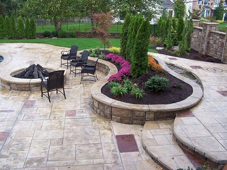 Multi layered patio with stamped concrete in multiple colors