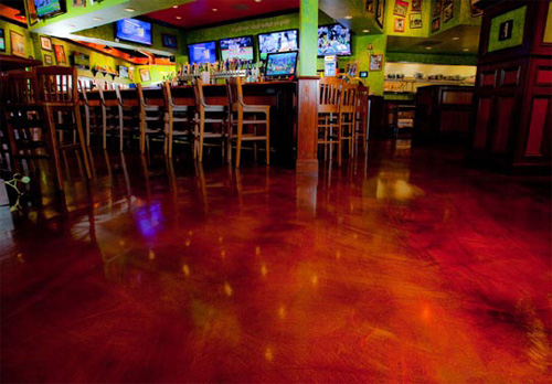 A floor that has been repaired with an overlay and color in 6,000 square feet of space