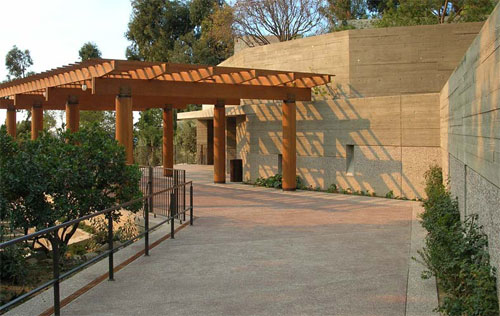 A pergola sits outside the museum at the top if this ramp.