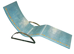 Teal concrete lounge chair with arms and orange accents.
