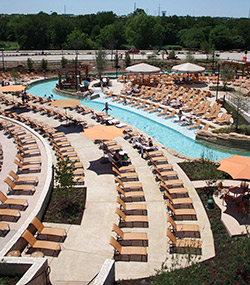 On patios and pool decks at Paradise Springs water park, part of the Gaylord Texan resort in Grapevine, Texas, Lonestar Concrete Systems installed integrally colored concrete in a custom-blended buff shade and troweled in millet seeds for texture.