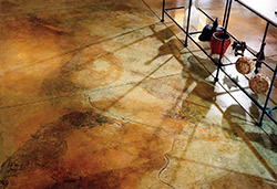 Shadows cast a neat light on the acid stained floor giving it dimension.