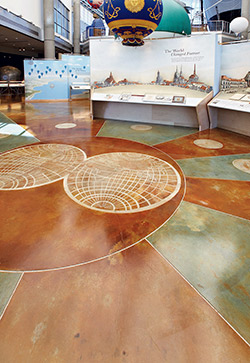 A circular pattern installed on a concrete floor using acid stain.