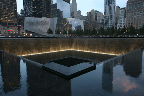 The National September 11 Memorial, which officially opened to the public Sept. 12, 2011, features a plaza with trees and twin reflecting pools, each nearly an acre in size that sit within the footprints where the North and South towers once stood.